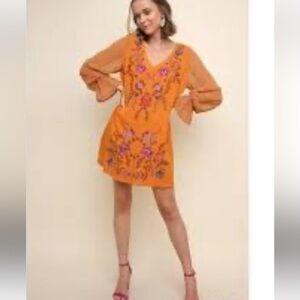 Umgee burnt orange floral mini dress. Worn a few times‎